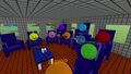 A group of players sitting in blue Chairs arranged in a circle.